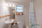 In the hall between the two bedrooms, there is a full bathroom. Access to this bathroom is easy from the living area as well.